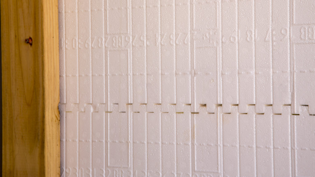 The block interlocks can be cut out to create a snug chase for electrical wires