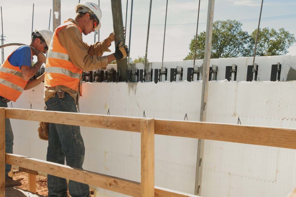 installers pouring concrete into icf walls, Ada, OK