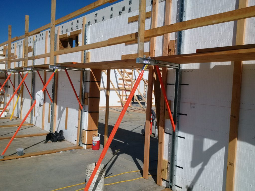 BuildBrace bracing and alignment system in use with wooden handrails
